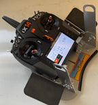 Three-quarter view of the Flying Tiger RC transmitter tray with both hand pads fitted and a radio mounted