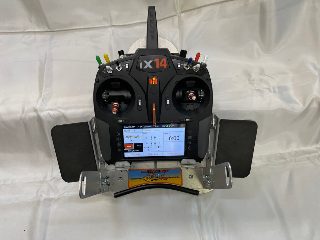 Flying Tiger RC transmitter tray with both hand pads fitted and a radio mounted, head-on view