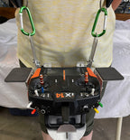 Flying Tiger RC transmitter tray with hand pads fitted, worn on the two-point shoulder harness with a radio mounted