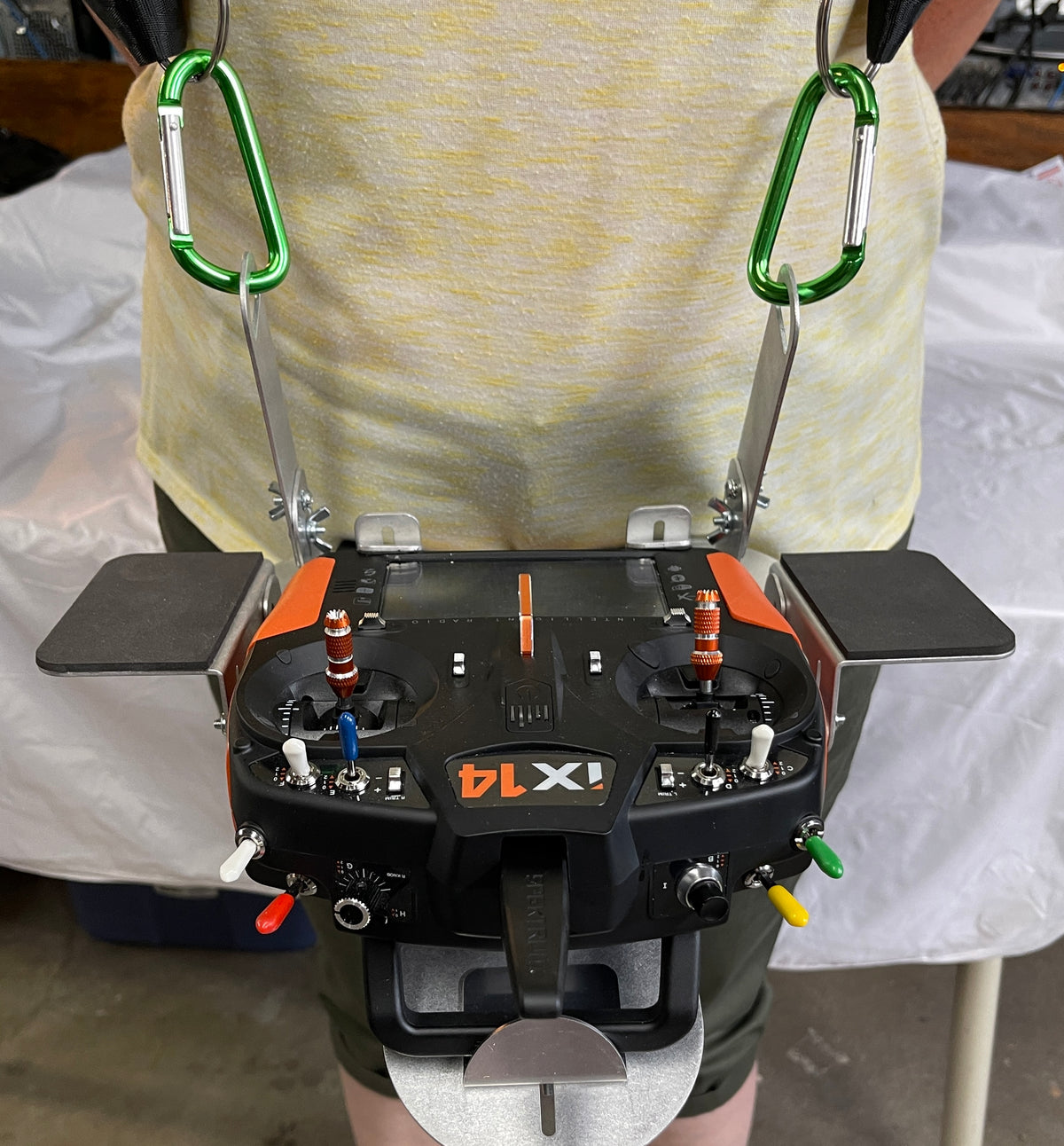 Flying Tiger RC transmitter tray with hand pads fitted, worn on the two-point shoulder harness with a radio mounted