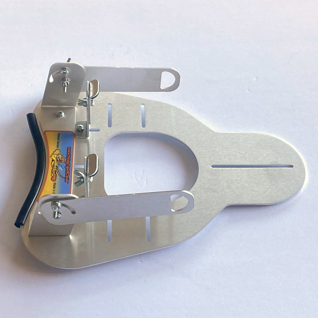 Flying Tiger RC transmitter tray laid flat, showing both securing arms and the harness support bracket, without hand pads