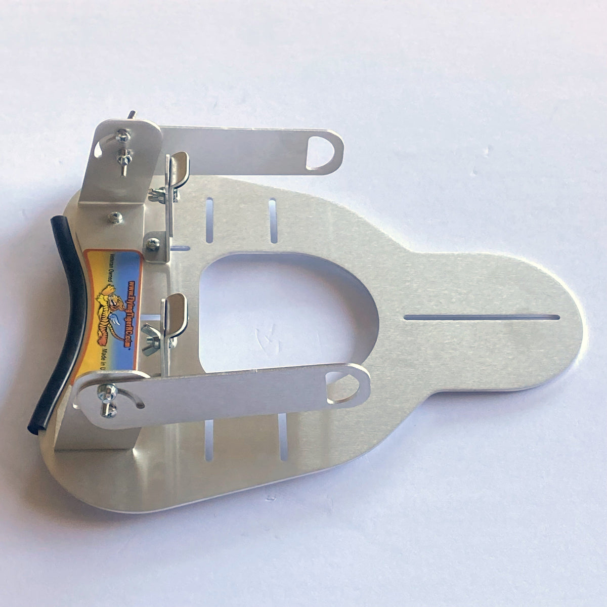 Flying Tiger RC transmitter tray laid flat, showing both securing arms and the harness support bracket, without hand pads