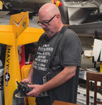 Pilot with the Flying Tiger RC transmitter tray and radio on the harness, no hand pads fitted, alternate frame