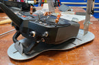 Close side view of a radio seated in the Flying Tiger RC transmitter tray, no hand pads fitted