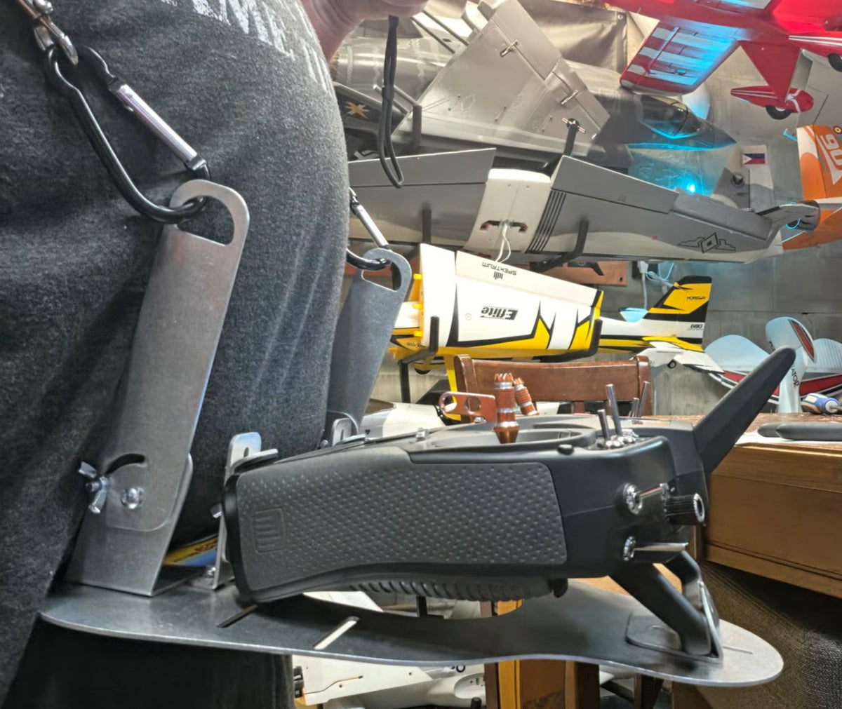 Side view of the Flying Tiger RC transmitter tray worn on the harness with a radio mounted, no hand pads fitted